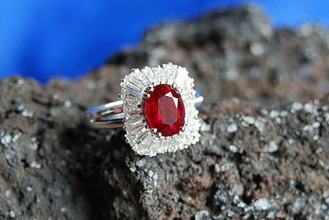 EXCEPTIONAL PIGEON BLOOD OVAL RUBY AND BAGUETTE DIAMOND RING