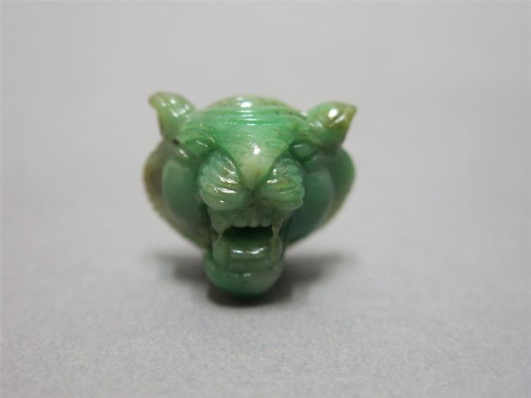 RARE AND FINELY CARVED JADEITE-JADE APPLE GREEN TIGER, 18/19TH CENTURY