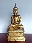 EXCEPTIONAL SHAN STATE GILT SOLID WOOD BUDDHA WITH SCRIPT, 19TH CENT.