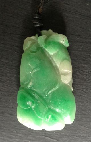 LARGE APPLE GREEN JADEITE PENDANT WITH ZOOMORPHIC CARVINGS