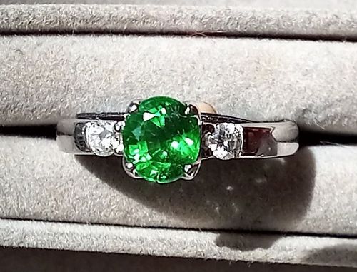 A Fine 18K. White Gold Ring set with a Tsavorite and 2 Diamonds