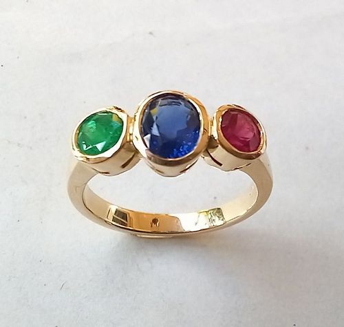 A 14K. Gold Ring set with a Sapphire, a Ruby and an Emerald