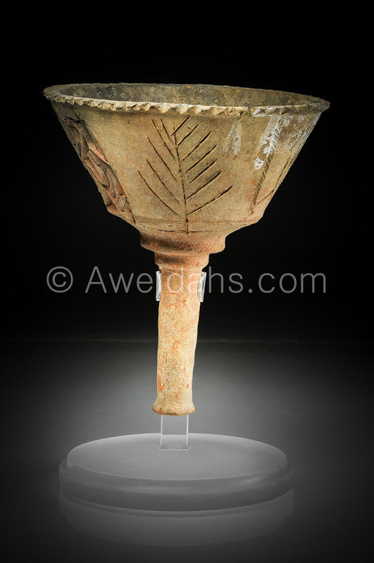 A Talmudic period pottery torch, 6th Century AD