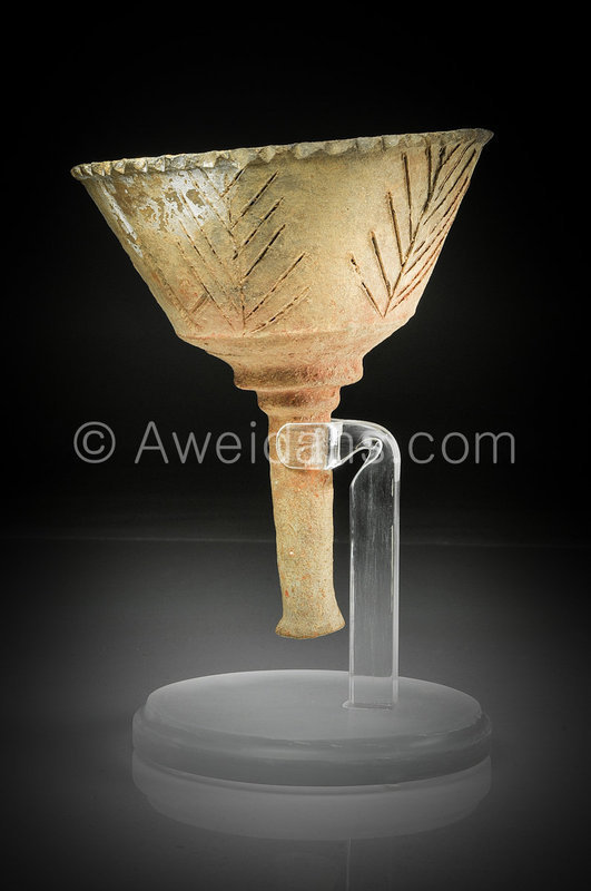 A Talmudic period pottery torch, 6th Century AD