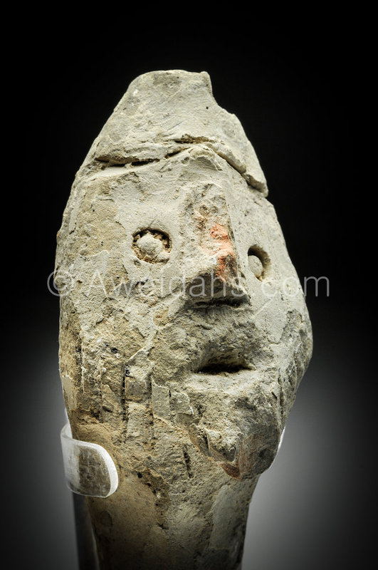 Canaanite pottery head of god wearing a helmet