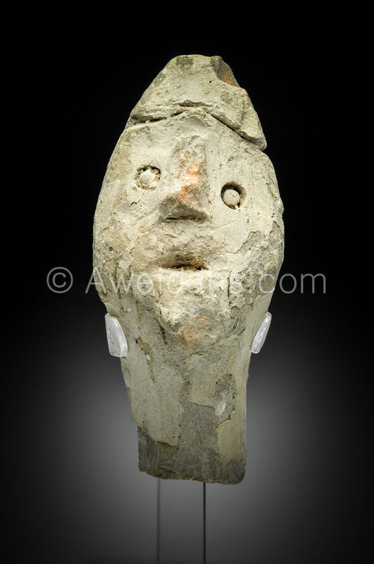 Canaanite pottery head of god wearing a helmet