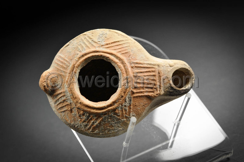 Roman decorated pottery oil lamp, 200 - 300 AD