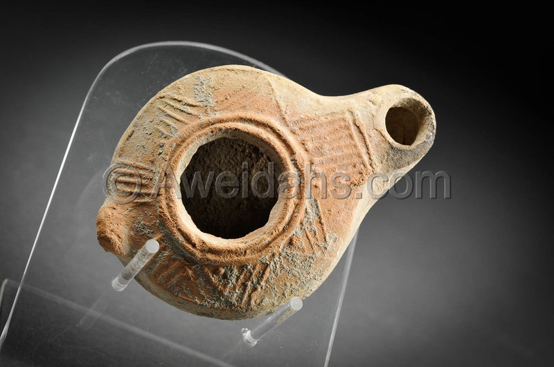 Roman decorated pottery oil lamp, 200 - 300 AD
