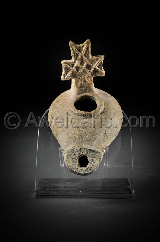 Byzantine pottery oil lamp with a cross-shaped handle, 500 A.D.