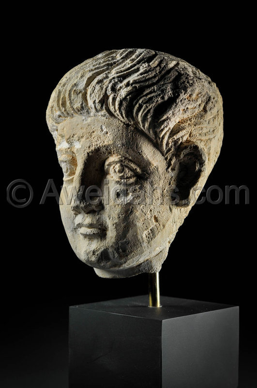 Limestone head of a youth, Roman Palmyra, 1st Century A.D