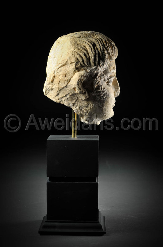 Limestone head of a youth, Roman Palmyra, 1st Century A.D