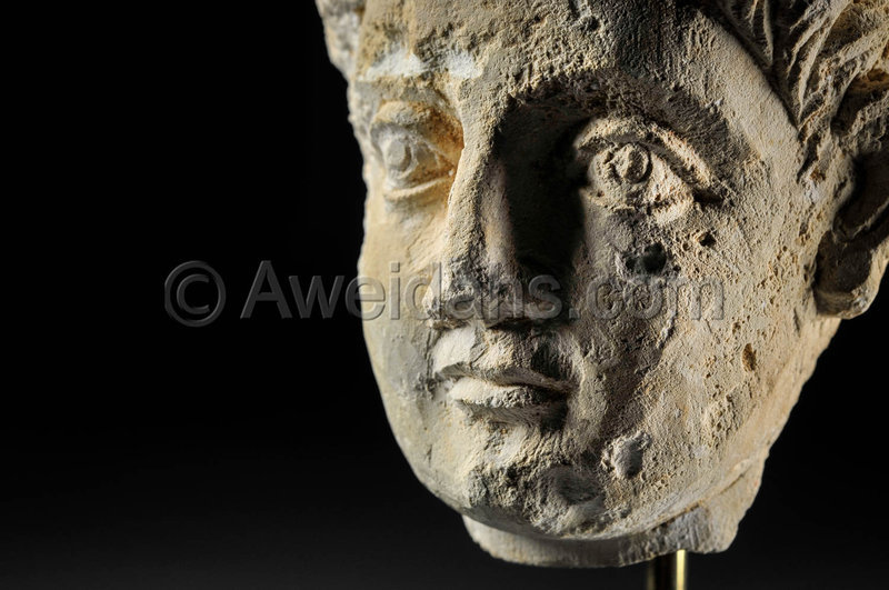 Limestone head of a youth, Roman Palmyra, 1st Century A.D