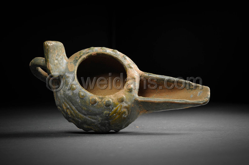 Islamic glazed pottery oil lamp, 12th Century AD
