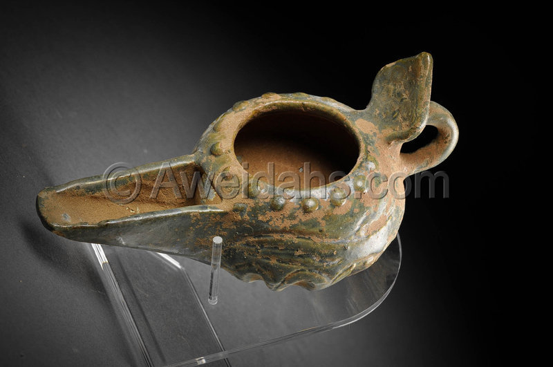 Islamic glazed pottery oil lamp, 12th Century AD