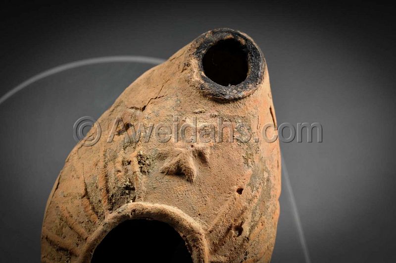 Byzantine pottery oil lamp with a cross, 400 AD