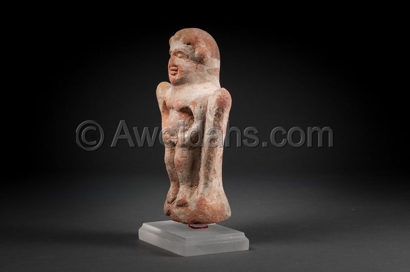 HOLLOW TERRACOTTA FIGURE OF A STANDING IDOL, 100 BC/AD