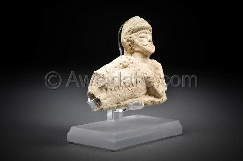 Ancient Parthian clay figure of a reclining man, 100 AD