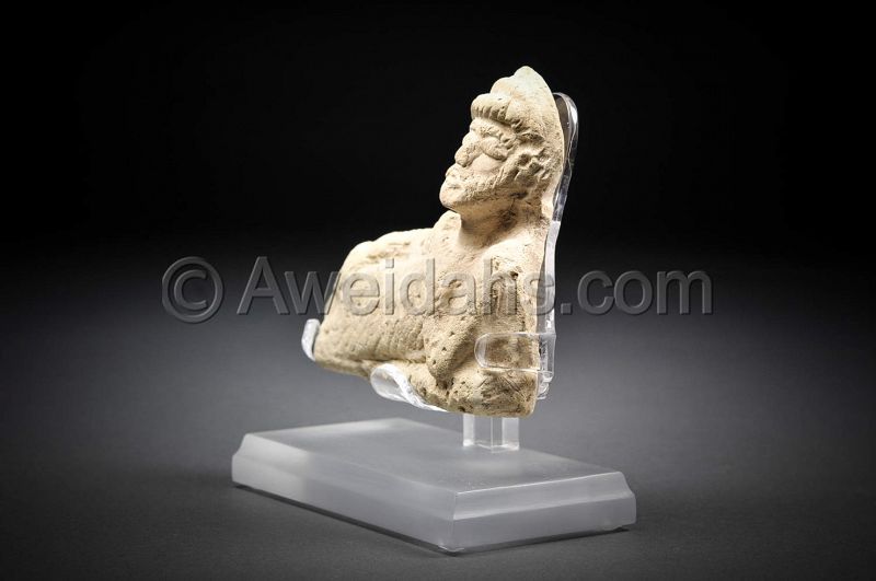 Ancient Parthian clay figure of a reclining man, 100 AD