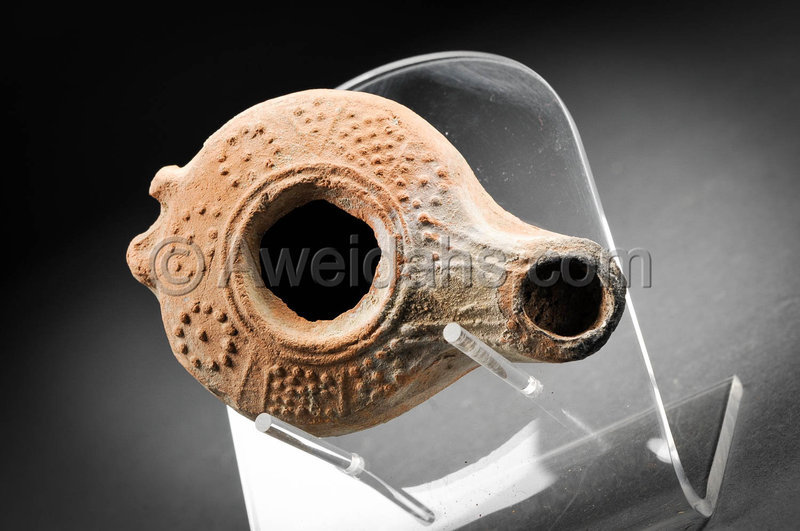 Roman decorated pottery oil lamp, 200 - 300 AD