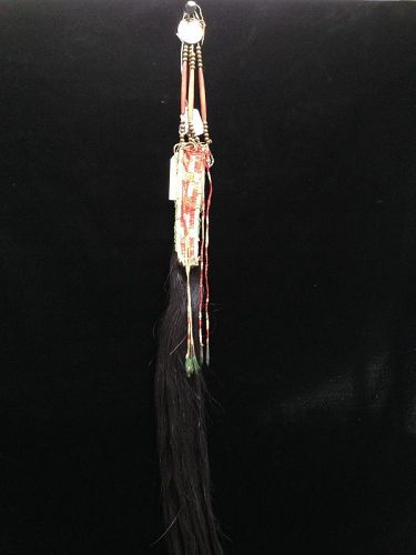 A Sioux Quilled Hide Hair Ornament
