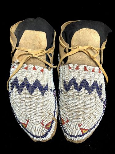 A pair of Ute Beaded Hide Moccasins