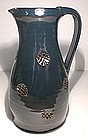 Temmoku Glazed Jug With Impressed Waffle Decoration