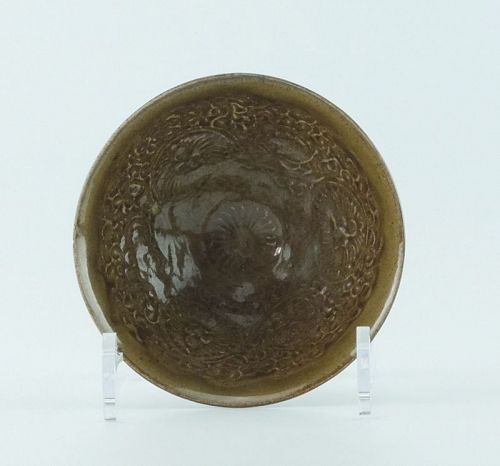 A Chinese, olive glazed, moulded bowl; Song-Jin dynasty