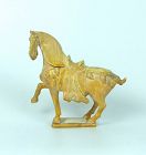 A Chinese yellow-glazed caparisoned horse, Sui dynasty