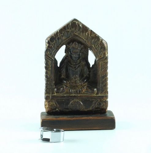 A carved wooden Buddha figure; probably Nepalese