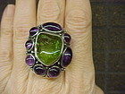 MODERNIST H. FRED SKAGGS PERIDOT AND AMETHYST RING