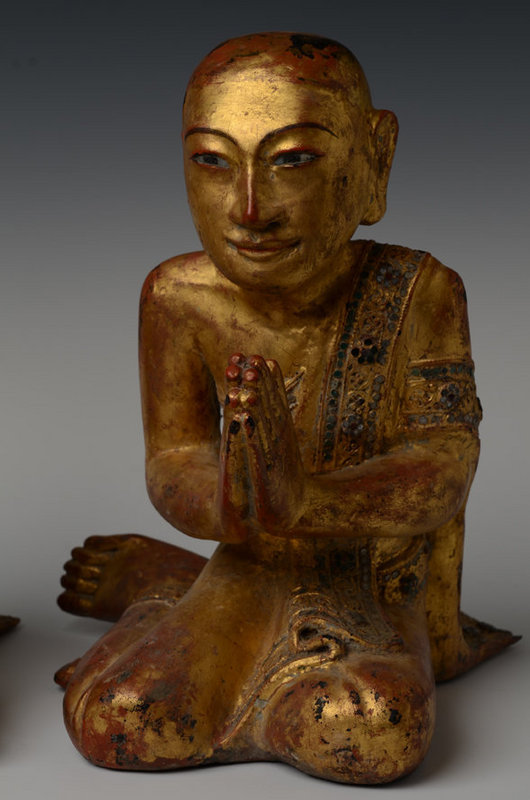19th C., A pair of Burmese Wooden Seated Disciples