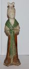 A figure of a lady in brown and green glazes. 6/7th Century AD.