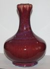 A Flambe glazed garlic necked bottle vase.