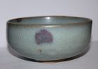 A Jun ware shallow bowl.