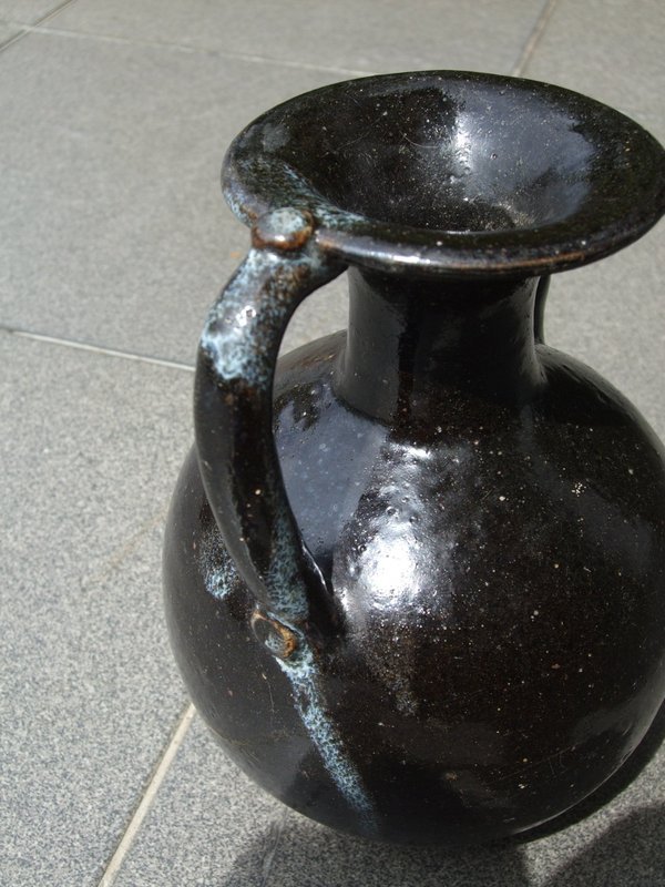 A Chinese phosphatic and treacle brown glaze stoneware