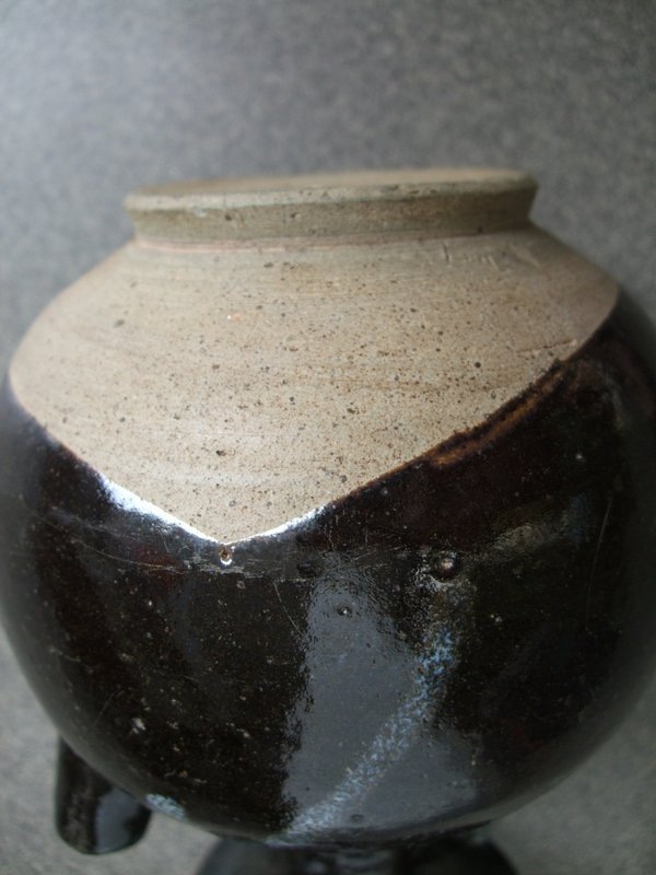 A Chinese phosphatic and treacle brown glaze stoneware