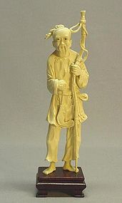CHINESE IVORY CARVING OF A FISHERMAN