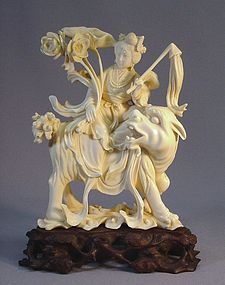 CHINESE IVORY CARVING OF A FAIRY AND MYTHICAL BEAST