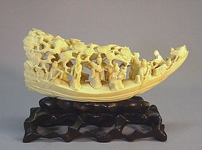 CHINESE WALRUS CARVING OF A BOAT WITH FAIRIES
