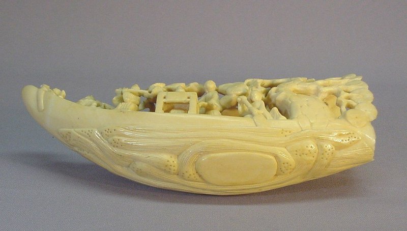 CHINESE WALRUS CARVING OF A BOAT WITH FAIRIES