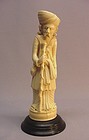 ASIAN IVORY CARVING OF A TRAVELING MERCHANT