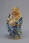 JAPANESE BLUE AND WHITE PORCELAIN STATUE