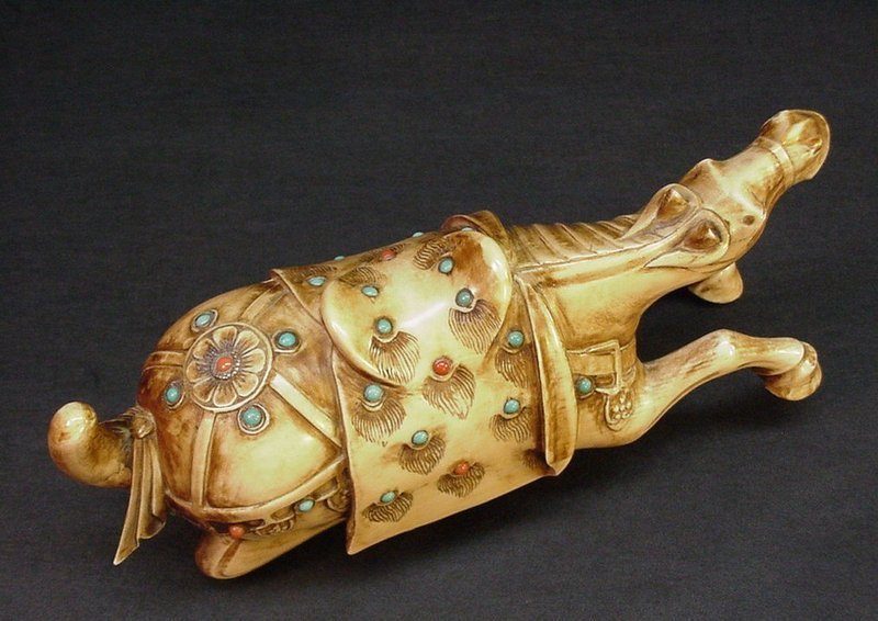 CARVED CHINESE IVORY RECLINING HORSE