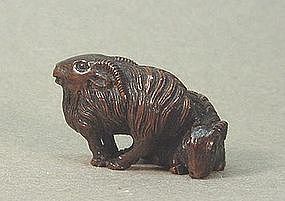 JAPANESE CARVED WOOD NETSUKE OF TWO RAMS