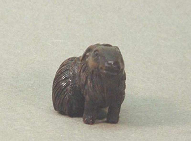 JAPANESE CARVED WOOD NETSUKE OF TWO RAMS