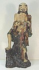 CHINESE POTTERY FIGURE OF AN IMMORTAL