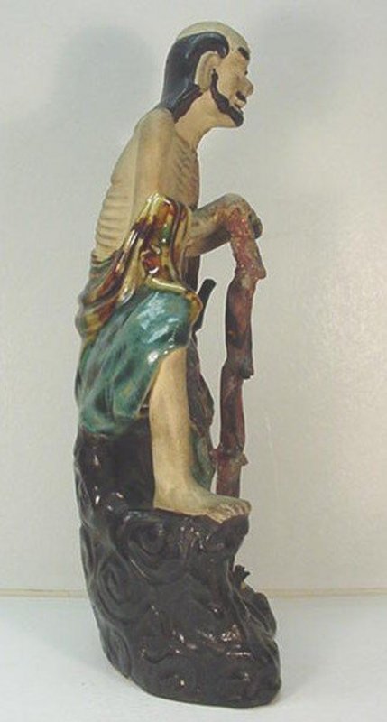CHINESE POTTERY FIGURE OF AN IMMORTAL