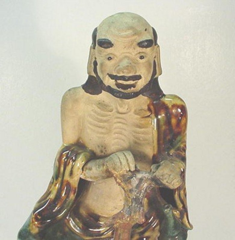 CHINESE POTTERY FIGURE OF AN IMMORTAL