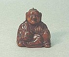 19TH C. JAPANESE WOOD NETSUKE OF KARAKO