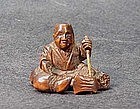 19th C. JAPANESE WOOD NETSUKE OF WOODCUTTER